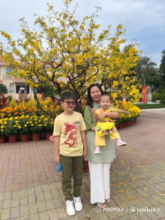 Woman and Child Engage in Playful Kung-Fu Under Yellow Blossoms – AI Generated Video | Hailuo AI