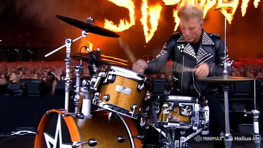 Heavy Metal Drummer: Intense Performance with Fiery Logo Backdrop – AI Generated Video | Hailuo AI