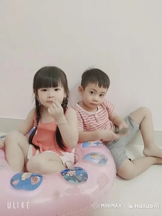 Siblings Play Fight on Inflatable Ring – AI Generated Video | Hailuo AI