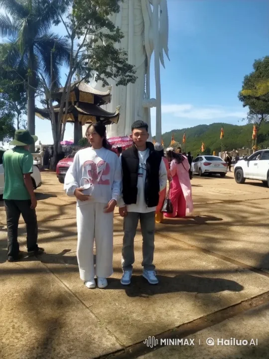 Casual Duo Perform Impressive Kung Fu by Outdoor Statue – AI Generated Video | Hailuo AI