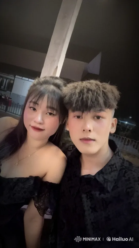 Couple Sharing an Intimate Moment in Elegant Black Attire – AI Generated Video | Hailuo AI