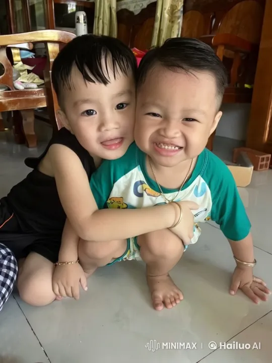 Two children perform kung fu in a playful home setting. – AI Generated Video | Hailuo AI