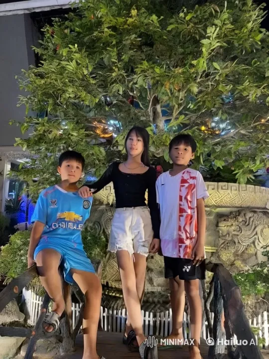 Children Playfully Interact on Bridge Amidst Festive Decor – AI Generated Video | Hailuo AI