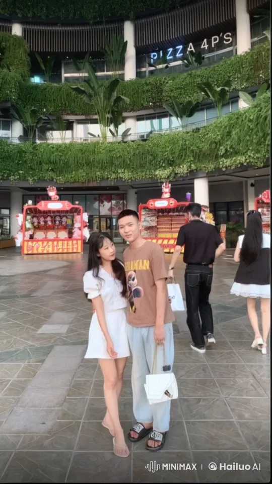 Young Couple Engages in Playful Kungfu Sparring in Lively Plaza – AI Generated Video | Hailuo AI