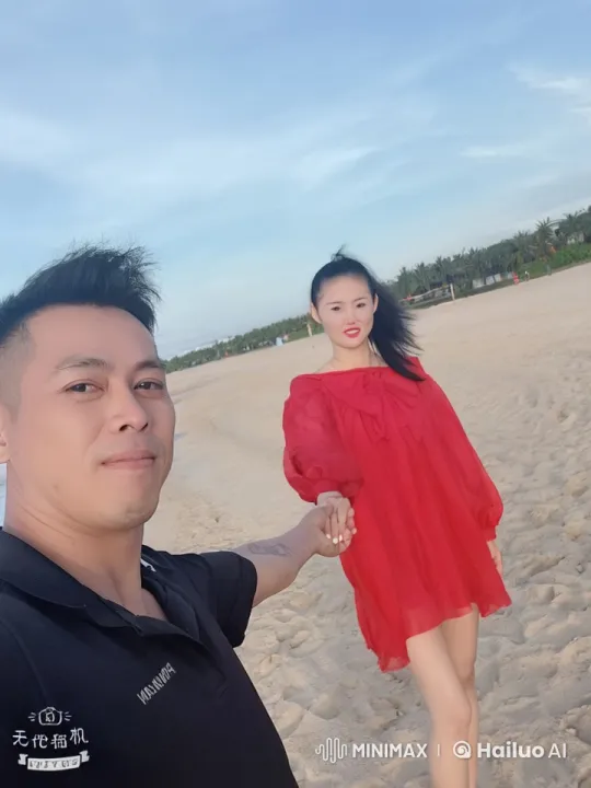 Woman in Red Dress and Man in Black Shirt Engage in Intense Beach Kung Fu Battle – AI Generated Video | Hailuo AI