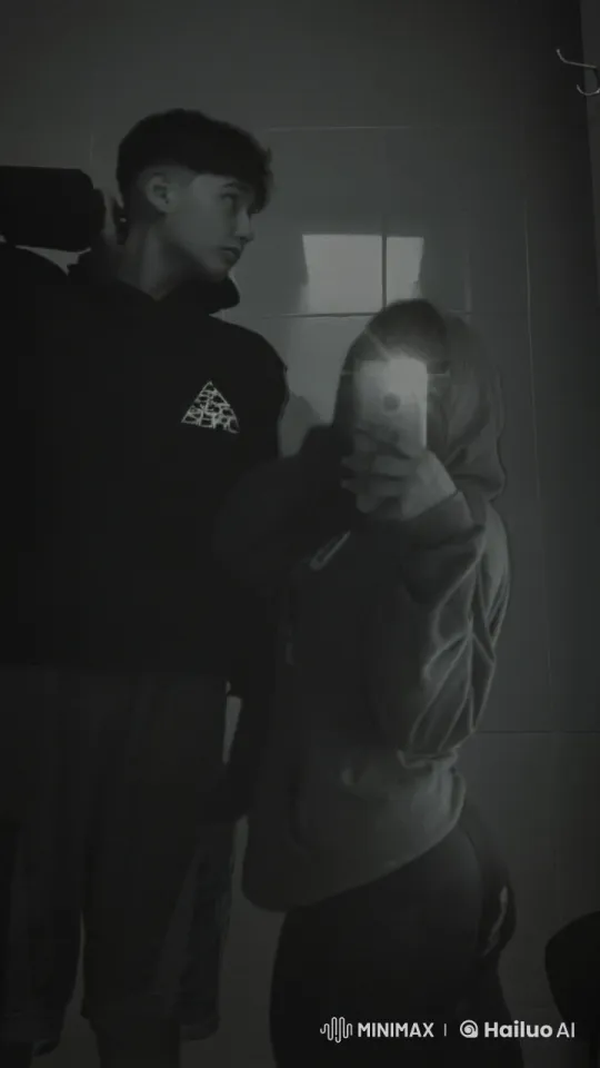 Affectionate Moment Between a Boy and Girl in Dim Lighting – AI Generated Video | Hailuo AI