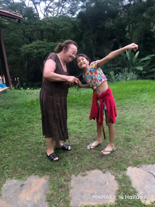 Joyful Reunion in Lush Greenery Amidst Sudden Rain – AI Generated Video | Hailuo AI