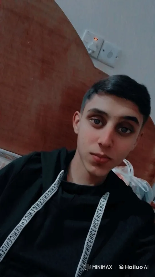 Young Man Smokes Casually in Dimly Lit Room – AI Generated Video | Hailuo AI