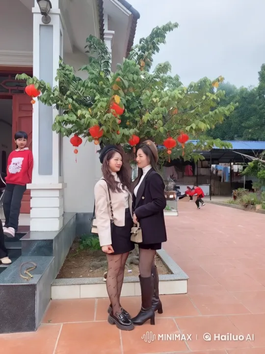 Stylish Women Practice Kung Fu at Festive Entrance – AI Generated Video | Hailuo AI