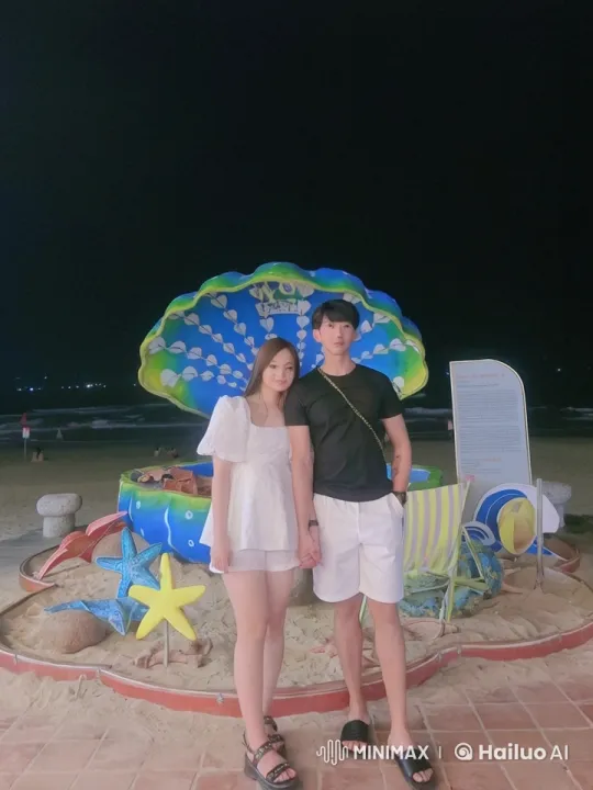 Couple Performs Kungfu on Night Beach with Decorative Backdrop – AI Generated Video | Hailuo AI