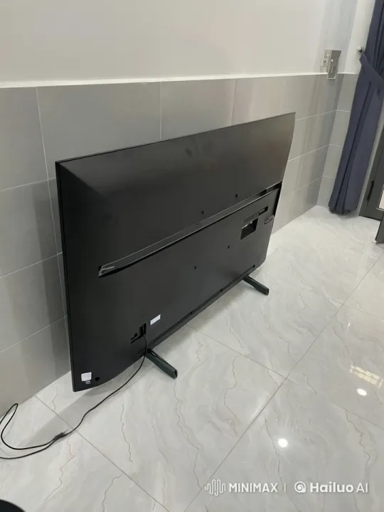 TV with Legs Walks Across Room to Door – AI Generated Video | Hailuo AI