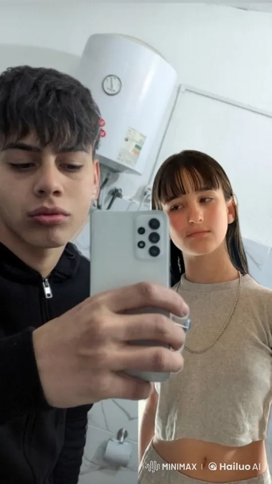 Boy and Girl Share Intimate Kiss in Mirror Selfie – AI Generated Video | Hailuo AI