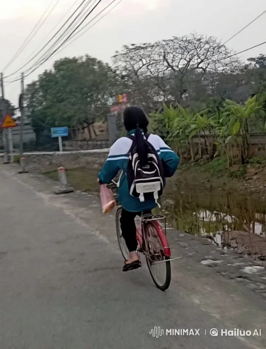 Young Girl Pedals Through Rural Landscape – AI Generated Video | Hailuo AI