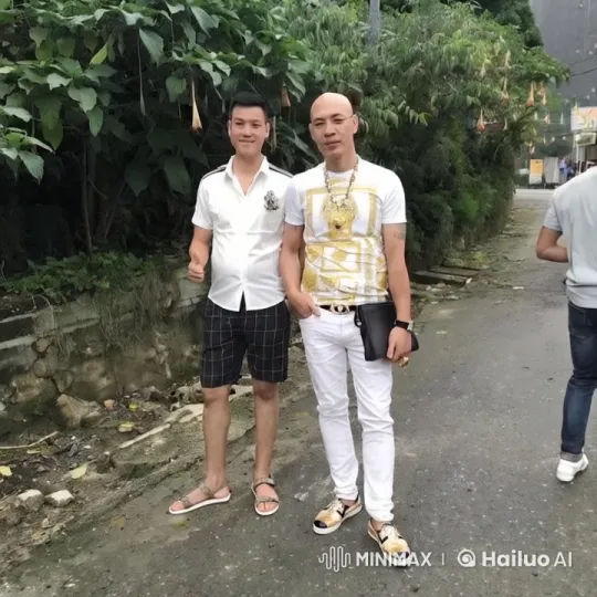 Two Men Pose Casually Amidst Lush Greenery – AI Generated Video | Hailuo AI