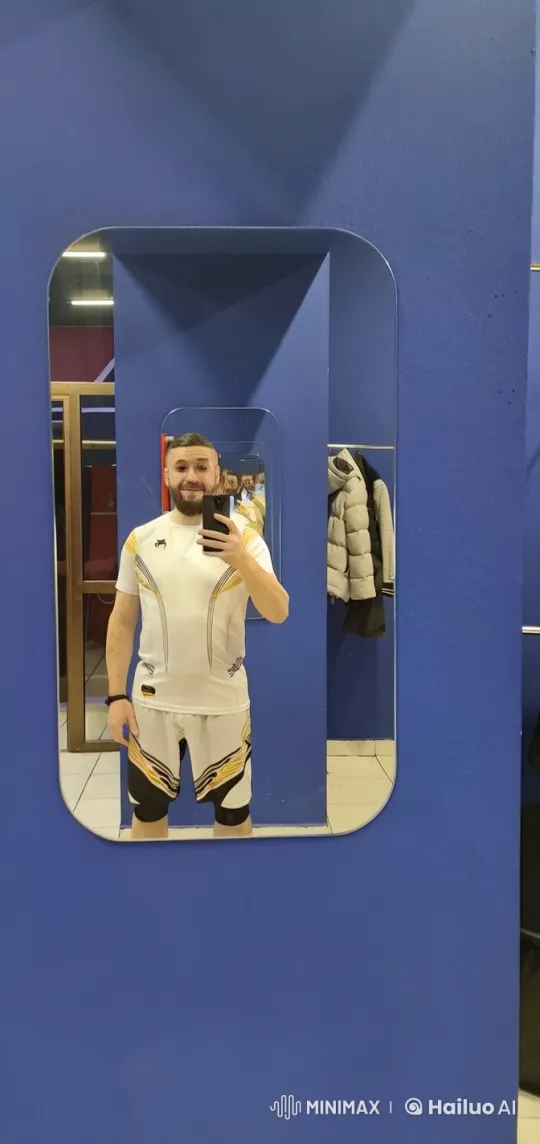 Athlete Flexes, Jogs Enthusiastically in Mirror Selfie – AI Generated Video | Hailuo AI