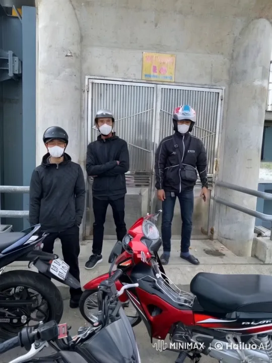 Three Men and Motorcycles Stand by Metal Gate – AI Generated Video | Hailuo AI