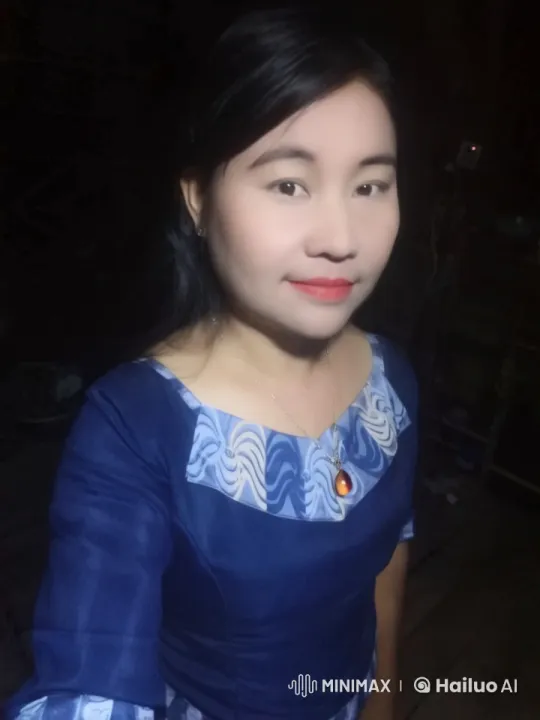 Woman in Blue Dress with Pendant in Dimly Lit Room – AI Generated Video | Hailuo AI