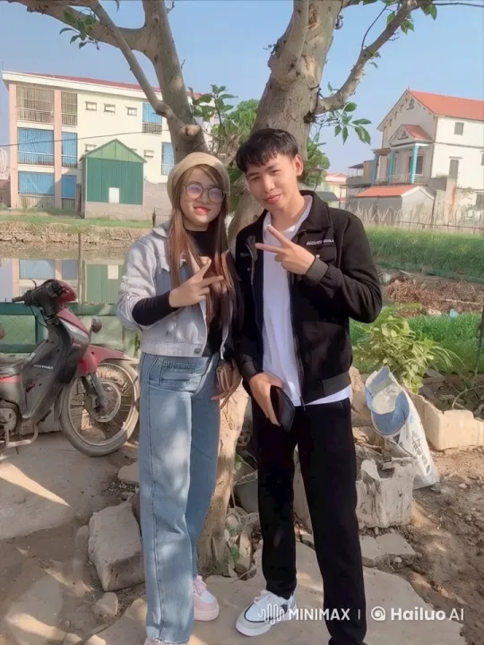 Young Couple Doing Kungfu Poses by Tree – AI Generated Video | Hailuo AI