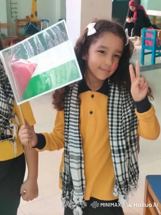 Young Girl Celebrates with Palestinian Flag in Classroom – AI Generated Video | Hailuo AI
