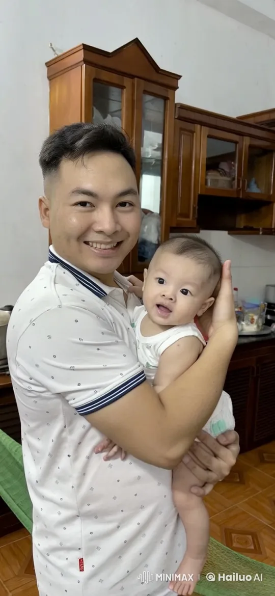 Young Man Practices Kungfu with Baby in Kitchen – AI Generated Video | Hailuo AI