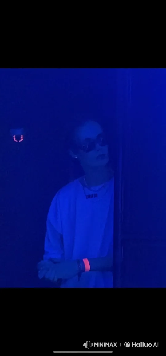 Mysterious Person Peeks Around Corner in Dim Blue Light – AI Generated Video | Hailuo AI