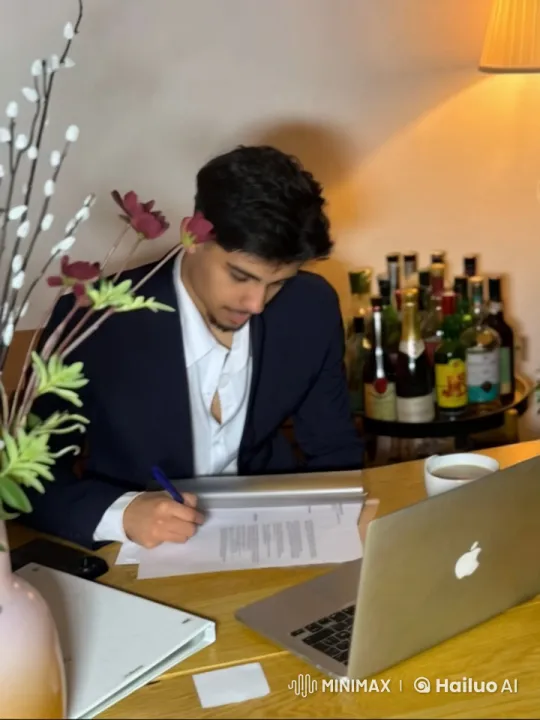 Young Man Reflects While Writing Amidst Office Necessities – AI Generated Video | Hailuo AI