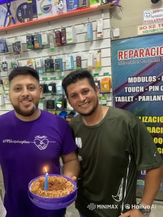Two Men Celebrate Friendship with Cake in Tech Store – AI Generated Video | Hailuo AI