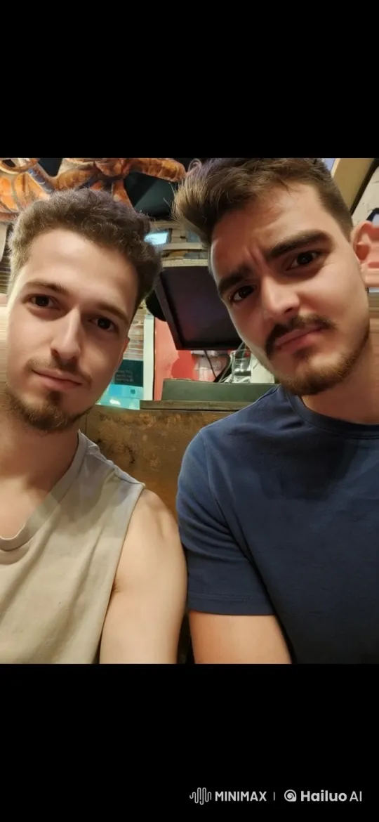Two Men Share a Tender Kiss in a Casual Setting – AI Generated Video | Hailuo AI