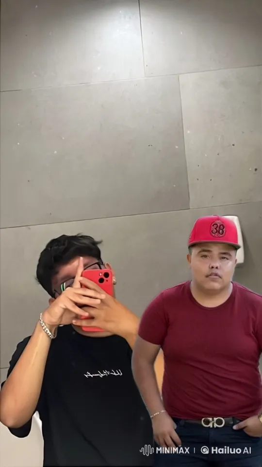 Two Friends Embrace in a Well-Lit Room – AI Generated Video | Hailuo AI