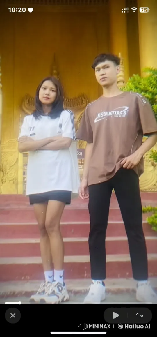 Young Couple Performs Dynamic Martial Arts in Front of Ornate Structure – AI Generated Video | Hailuo AI