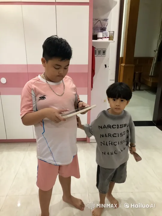 Children Playfully Fight Over iPad with Kungfu Moves – AI Generated Video | Hailuo AI
