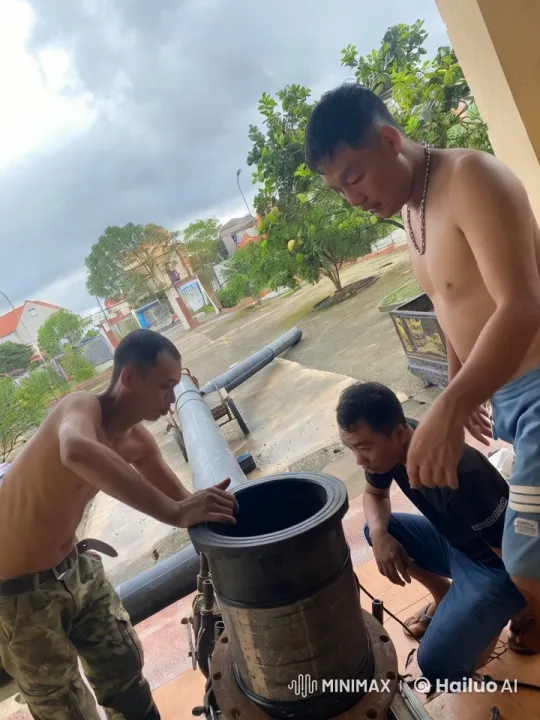 Three Men Assemble Machinery on Overcast Day – AI Generated Video | Hailuo AI