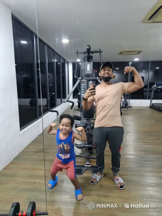 Man and Child Bond Over Exercise and Kung Fu in Gym – AI Generated Video | Hailuo AI