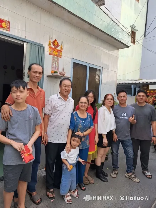 Family Celebration in Front of Festive House – AI Generated Video | Hailuo AI