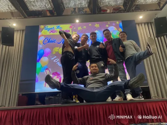 Friends Celebrate with Kung Fu Poses on Colorful Stage – AI Generated Video | Hailuo AI