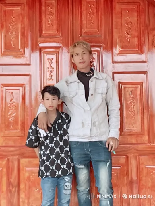 Father-Son Kung Fu Display in Front of Red Door – AI Generated Video | Hailuo AI
