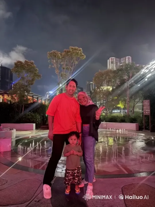 Family Enacts Kungfu Moves in Nighttime City Fountain Scene – AI Generated Video | Hailuo AI