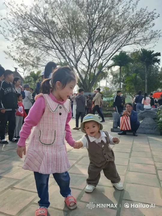 Girl and Toddler's Playful Mock Fight in Park – AI Generated Video | Hailuo AI