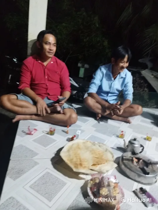 Two Men Relaxing and Sharing a Meal on a Floor – AI Generated Video | Hailuo AI