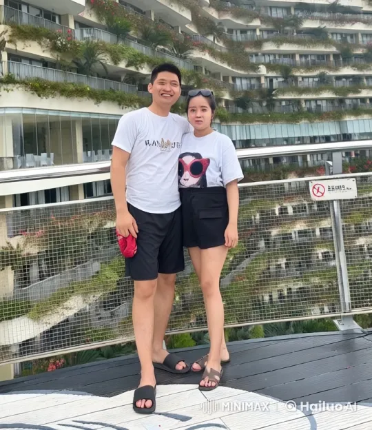 Couple Practicing Kungfu on Balcony with Green Building – AI Generated Video | Hailuo AI