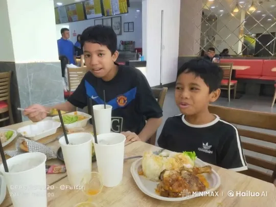Children Dining Enjoying Meals at Restaurant Table – AI Generated Video | Hailuo AI