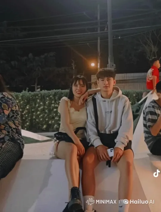 Young Couple Witness Boy's Kung Fu in Night Setting – AI Generated Video | Hailuo AI