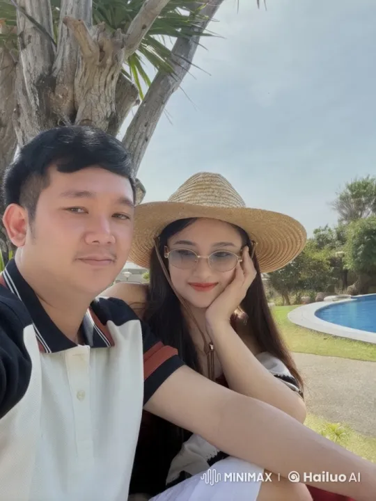 Couple Takes Selfie by the Pool in Sunny Serenity – AI Generated Video | Hailuo AI