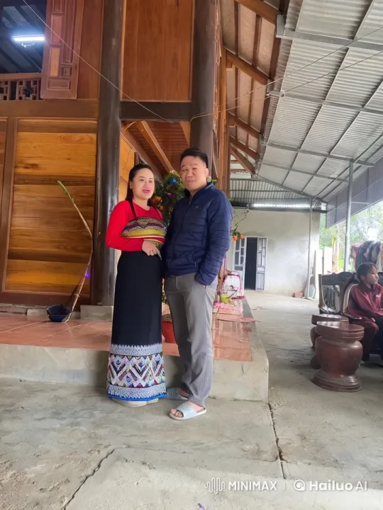 Couple's Tender Moment in Front of Traditional House – AI Generated Video | Hailuo AI