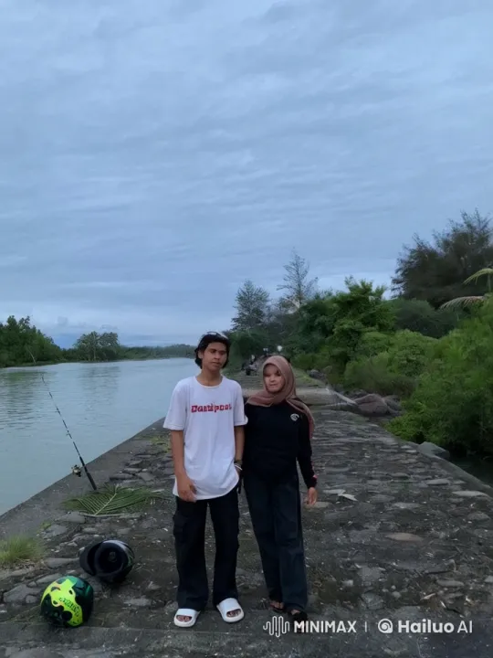 Young Couple Reflects by a Tranquil River on Cloudy Afternoon – AI Generated Video | Hailuo AI