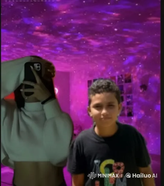 Intimate Embrace Set Against Galaxy Projected Room – AI Generated Video | Hailuo AI