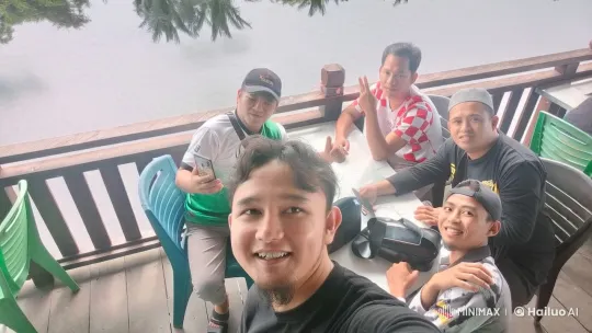 Friends Relaxing on a Wooden Deck by Water – AI Generated Video | Hailuo AI