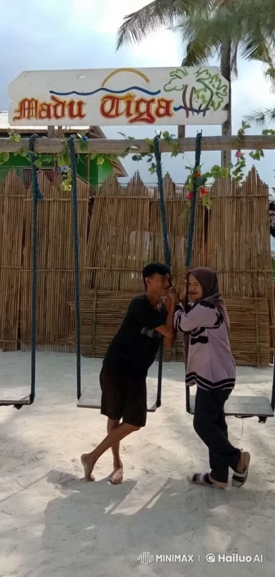 Playful Kung Fu Fight on Tropical Beach Swing Set – AI Generated Video | Hailuo AI