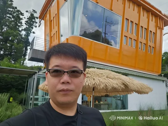 Man Sips Beer Outside Modern Building on Cloudy Day – AI Generated Video | Hailuo AI