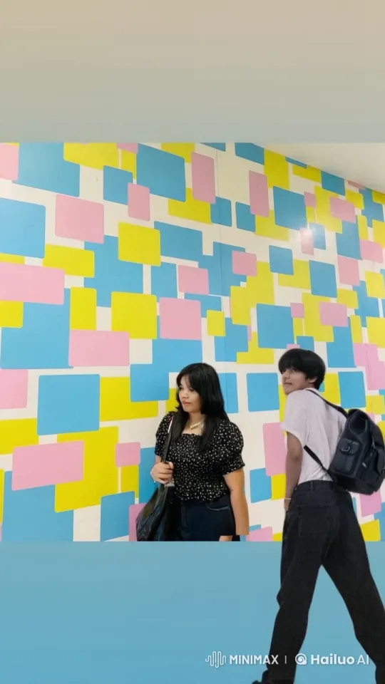 Two Friends Embrace in Front of Colorful Wall – AI Generated Video | Hailuo AI